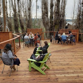 David Coffaro Winery - a group of people sitting on a deck - Wineries Near Me - Geyserville, California