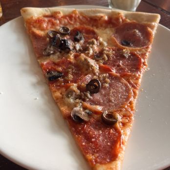 Nine Pies Pizzeria - Sausage and black olives slice. - Pizza Near Me - Seattle, Washington