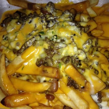 Tacos Charly - Papas Nachos with carne asada. They use both shredded and nacho cheese. - Mexican Near Me - Pacoima, California Tacos Charly - Papas Nachos with carne asada. They use both shredded and nacho cheese. - Mexican Near Me - Pacoima, California