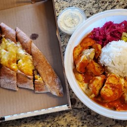 Left: Meat Lover's Pide; Right: Chicken Iskender Left: Meat Lover's Pide; Right: Chicken Iskender