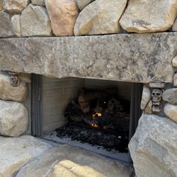 R Horne Hearth And Home - Outdoor fireplace log arrangement and decorative sand/rock