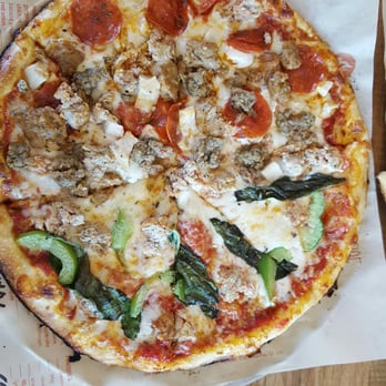 Blaze Pizza - Half and half a Build Your Own!  My son got lots of meat while I got turkey meatballs, green peppers, and basil. - Salad Near Me - Palm Desert, California