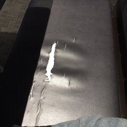 Buffalo Wild Wings - Ripped up bench seat. The one next to ours was ripped and adorned with duct tape.