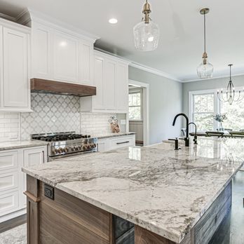 Distinctive Domain - a large kitchen with white cabinets and marble countertops - General Contractors Near Me - Warren, New Jersey Distinctive Domain - a large kitchen with white cabinets and marble countertops - General Contractors Near Me - Warren, New Jersey