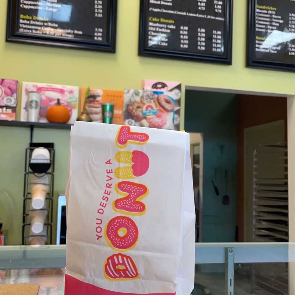 a bag of doughnuts on a counter a bag of doughnuts on a counter