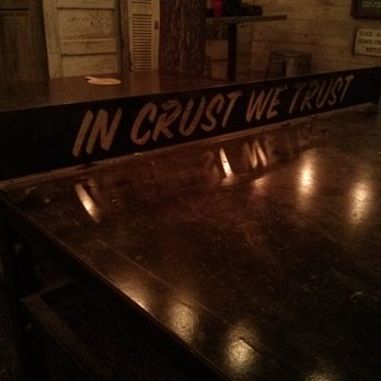 Home Slice Pizza - "In crust we trust" ping pong table in back patio area - Pizza Near Me - Austin, Texas Home Slice Pizza - "In crust we trust" ping pong table in back patio area - Pizza Near Me - Austin, Texas