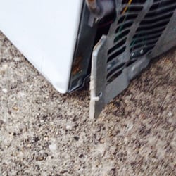 Refrigerator City - Broken, dented, rusty and missing a screw
