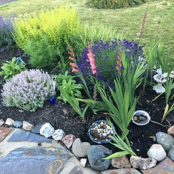 Northwest Naturescapes - beautiful pathways and her gardens in the front yard - Landscaping Near Me