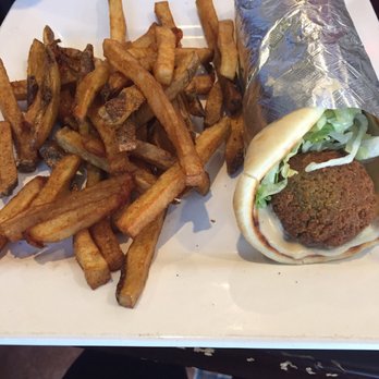 Tripoli's - Falafel pita wrap and side of fries. - Mediterranean Near Me - San Antonio, Texas Tripoli's - Falafel pita wrap and side of fries. - Mediterranean Near Me - San Antonio, Texas