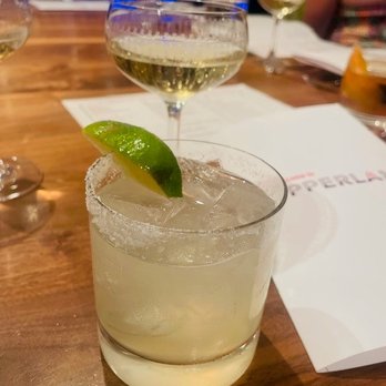 Supperland - Spicy Skinny Margarita front. Champagne behind - Southern Near Me - Charlotte, North Carolina Supperland - Spicy Skinny Margarita front. Champagne behind - Southern Near Me - Charlotte, North Carolina