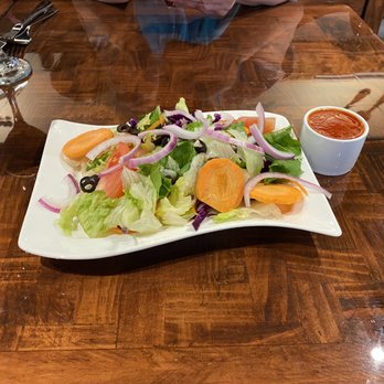Little Rome - House salad, tomato based vinaigrette. - Italian Near Me - Plano, Texas Little Rome - House salad, tomato based vinaigrette. - Italian Near Me - Plano, Texas