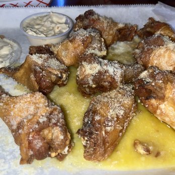 Front Row Sports Bar And Grill - Garlic Parmesan bone in wings - Sports Bars Near Me - Ocoee, Florida