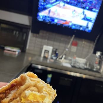 Dog Haus - Hangover Burrito at the bar top and a triple double on the screen! - Burgers Near Me - Northridge, California Dog Haus - Hangover Burrito at the bar top and a triple double on the screen! - Burgers Near Me - Northridge, California