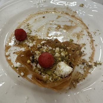Uptown Blanco Restaurant - Goat cheese, pistachio, honey tart appetizer with raspberries - American Near Me - Blanco, Texas