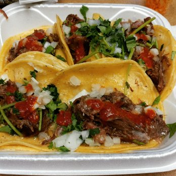 Mi Pueblito Meat Market - Steak tacos with cilantro and onion. Optional but must-try hot sauce makes this a perfect helping of street tacos. - Meat Shops Near Me - Shawnee, Kansas
