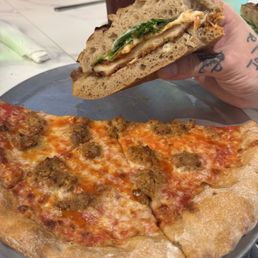 Chicken Parmesan sandwich, sausage and hot honey pizza, both fantastic