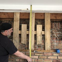Ken's Carpentry - Ken took down entertainment center rewired area and created area for mounting