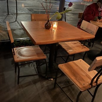 Coffee Mob Bar & Roastery - a woman sitting at a table - Wine Bars Near Me - Brooklyn, New York
