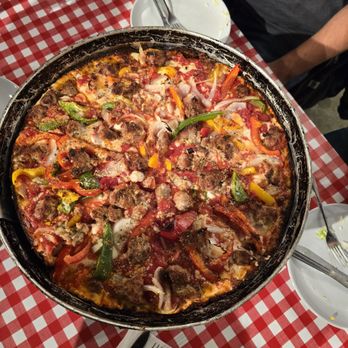Burt's Place - Deep dish pizza. Peppers, onion, and sausage - Pizza Near Me - Lafayette, Indiana