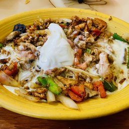 a yellow bowl of food on a table a yellow bowl of food on a table
