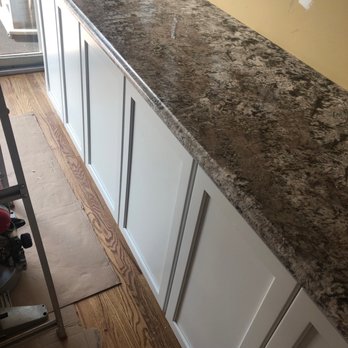 Napoli Marble & Granite Design - a kitchen counter being installed - General Contractors Near Me - Seaford, New York