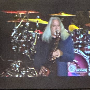 PNC Bank Arts Center - Screen at the arena while The Doobie Brothers are playing. Nostalgic! - Ticket Sales Near Me - Holmdel, New Jersey PNC Bank Arts Center - Screen at the arena while The Doobie Brothers are playing. Nostalgic! - Ticket Sales Near Me - Holmdel, New Jersey