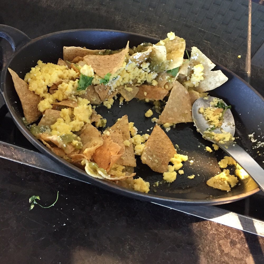 The Centurion Lounge - Chilaquiles with scrambled eggs quest fresco and salsa verde - Airport Lounges Near Me - Miami, Florida The Centurion Lounge - Chilaquiles with scrambled eggs quest fresco and salsa verde - Airport Lounges Near Me - Miami, Florida
