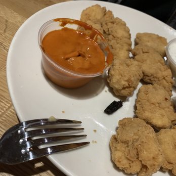 Applebee's Grill + Bar - Burnt chunk, dirty fork and odd looking Buffalo sauce - Sports Bars Near Me - Onalaska, Wisconsin Applebee's Grill + Bar - Burnt chunk, dirty fork and odd looking Buffalo sauce - Sports Bars Near Me - Onalaska, Wisconsin