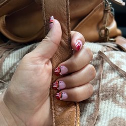 Snider's Nail Salon - Diane never fails me. She designed this using my son's football team colors.