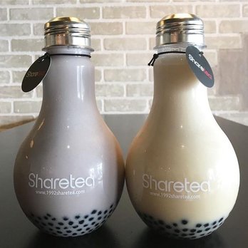 Tea Station - two bottles of bubble tea on a table - Bubble Tea Near Me - Windsor, Ontario Tea Station - two bottles of bubble tea on a table - Bubble Tea Near Me - Windsor, Ontario