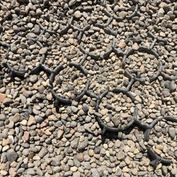 Orenco Dog Park - Grate pathway leading from entrances. Pea gravel everywhere else.