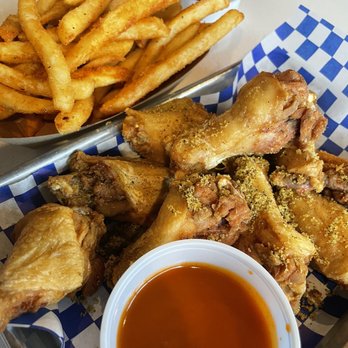 Gold Feather - Lemon pepper with honey tobacco sauce on the side, old El Paso fries - Beer Bar Near Me - San Antonio, Texas Gold Feather - Lemon pepper with honey tobacco sauce on the side, old El Paso fries - Beer Bar Near Me - San Antonio, Texas