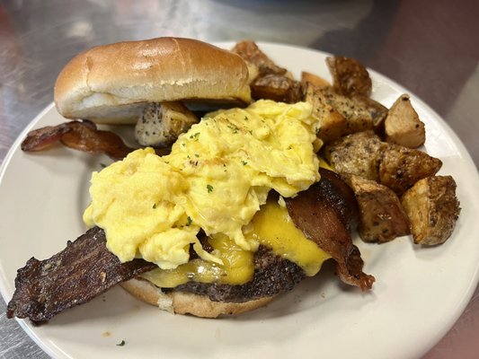 Photo of Jamie's Cafe - Elk Grove, CA, US. Ultimate breakfast burger with scrambled eggs and country potatoes. My favorite!