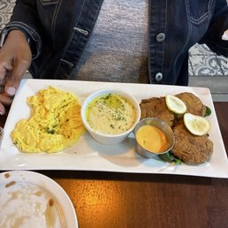 Today's special! eggs,grits and salmon crochets. Today's special! eggs,grits and salmon crochets.