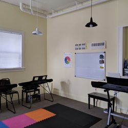The Music Room - The classroom includes a magnetic dry-erase board, where students practice note-reading and composition skills.