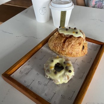 Momo Cafe - Black sesame latte, cappuccino, citrus chocolate mochi donut, citrus chocolate croissant - Desserts Near Me - Atlanta, Georgia Momo Cafe - Black sesame latte, cappuccino, citrus chocolate mochi donut, citrus chocolate croissant - Desserts Near Me - Atlanta, Georgia
