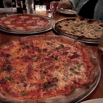 Pi Pizzaria - a variety of pizzas on a table - Pizza Near Me - Nantucket, Massachusetts