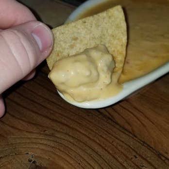Land Run Grill - Huge piece of sausage in the queso. - American Near Me - Norman, Oklahoma Land Run Grill - Huge piece of sausage in the queso. - American Near Me - Norman, Oklahoma