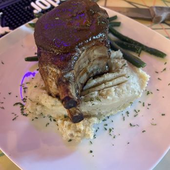 Ottos on the River - The before pic of the ginormous pork chop and fresh homemade mashed potatoes - Seafood Near Me - Augusta, Maine