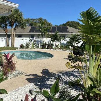 Garden State - a pool surrounded by palm trees - Landscape Architects or Designers Near Me