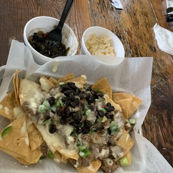 Baja Coop - Steak & Queso nachos with my side of black beans and some raw jalapeños added to this dish. Also in the background is a side of rice - Chicken Wings Near Me - Dalton, Georgia Baja Coop - Steak & Queso nachos with my side of black beans and some raw jalapeños added to this dish. Also in the background is a side of rice - Chicken Wings Near Me - Dalton, Georgia