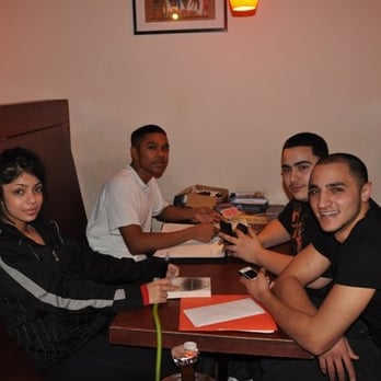 Nile Palace Café - a group of people sitting at a table - Hookah Bars Near Me - Scarborough, Ontario Nile Palace Café - a group of people sitting at a table - Hookah Bars Near Me - Scarborough, Ontario