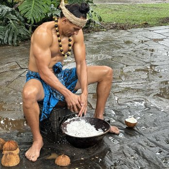 Toa Luau - Shaving coconut for dinner - Cultural Center Near Me - Haleiwa, Hawaii Toa Luau - Shaving coconut for dinner - Cultural Center Near Me - Haleiwa, Hawaii