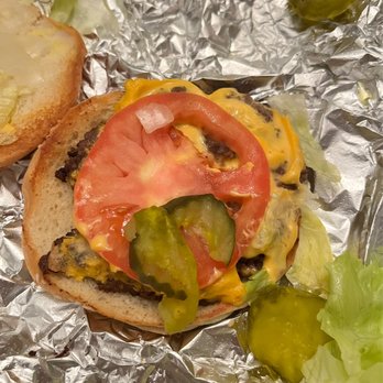 Five Guys - Little Cheeseburger (lettuce, tomato, onions, pickles) Really? The small pieces you see are from Five Guys. - Burgers Near Me - Loganville, Georgia
