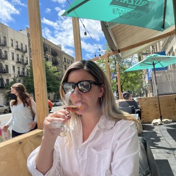 Calaveras Corner - Pretty lady drinking the $7 Rose - Mexican Near Me - New York, New York