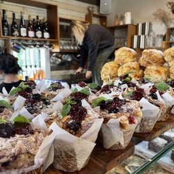 The Boatshed Cafe and Bistro - Bakery spread at the till - raspberry muffins and cheddar scones today