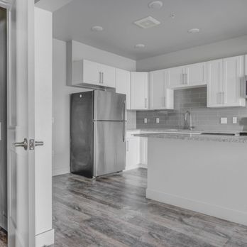 Copper 87 - Kitchen with a view of the laundry closet - Apartments Near Me - West Jordan, Utah Copper 87 - Kitchen with a view of the laundry closet - Apartments Near Me - West Jordan, Utah