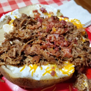 Bucky Bee's BBQ - Huge porky loaded baked potato, enough to share - Barbeque Near Me - Cave City, Kentucky