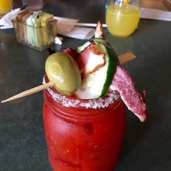Cafe Strudel - Bacon Bloody Mary (with fresh-squeezed OJ in the background). - New American Near Me - West Columbia, South Carolina
