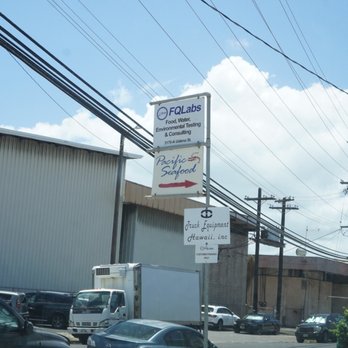 Pacific Seafood Distribution - Pacific seafood sign at the entrance of parking lot - Seafood Markets Near Me - Honolulu, Hawaii